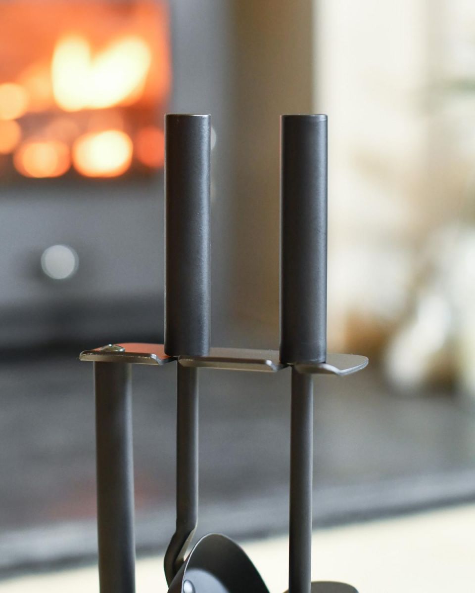 Close Up Of Black Suspended Brush & Pan Set Handles