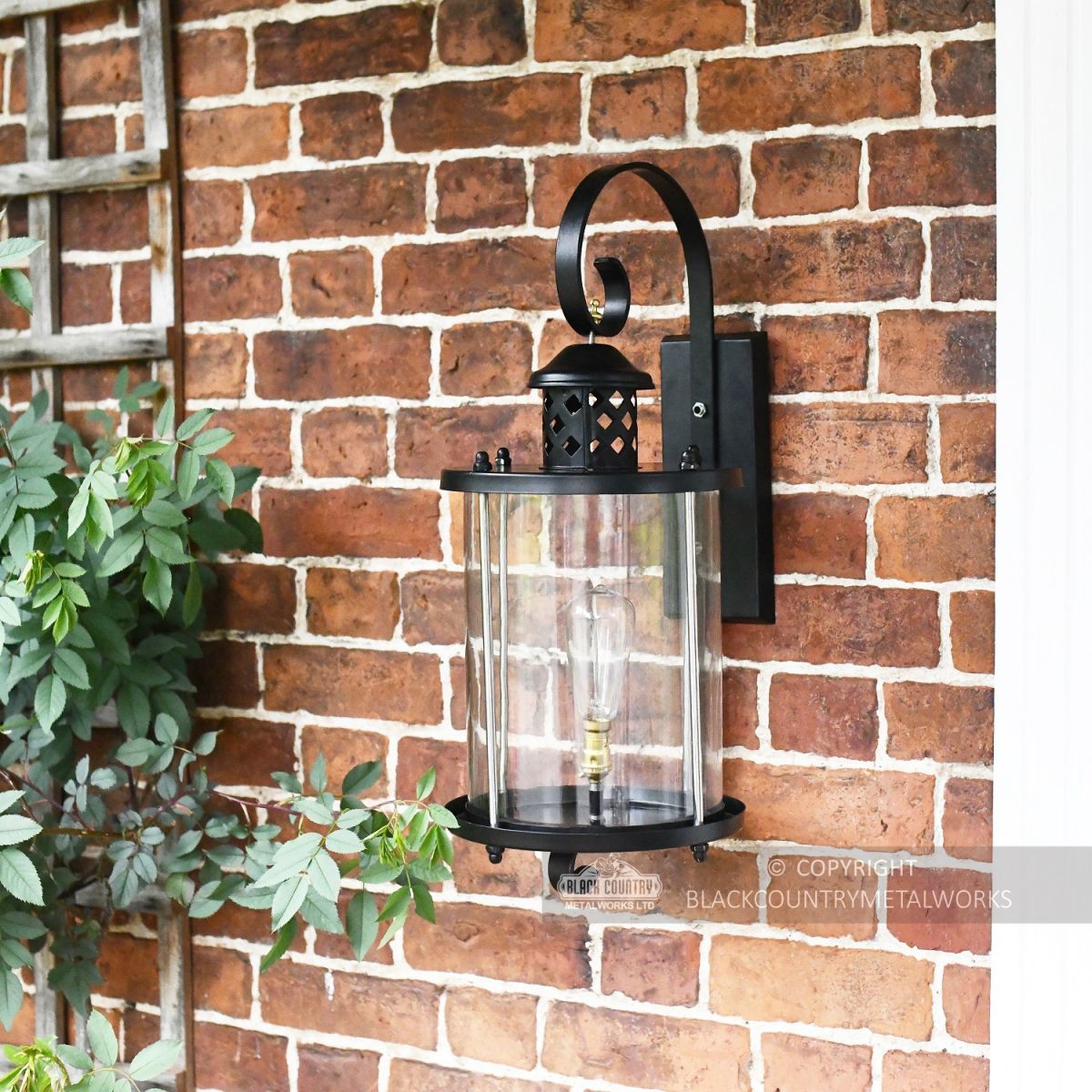 Black Suspended Cylindrical Lantern Installed On Wall Black Suspended Cylindrical Lantern Installed On Wall