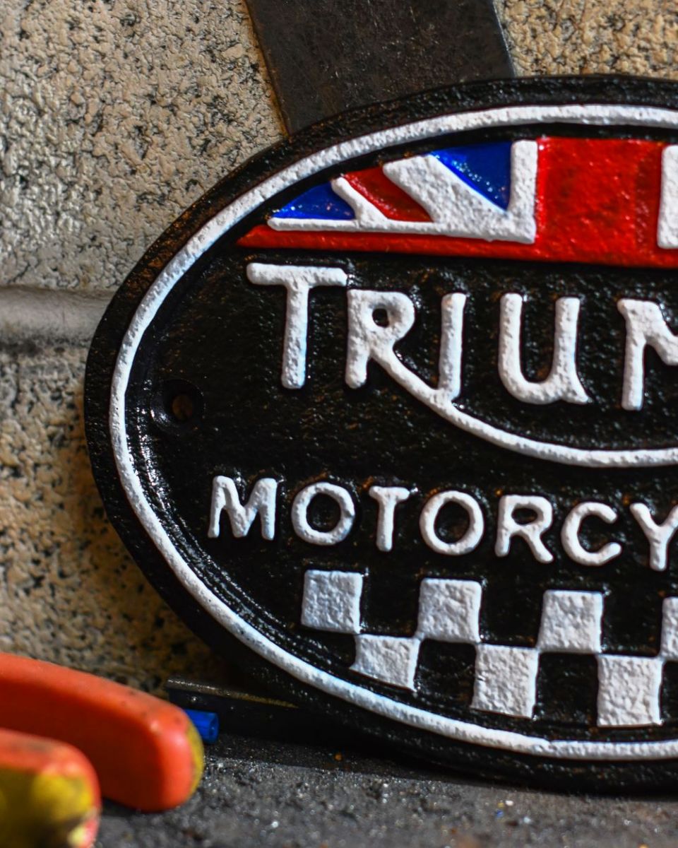Close up of Black Triumph Vintage Style Cast Iron Sign finish Close up of Black Triumph Vintage Style Cast Iron Sign finish