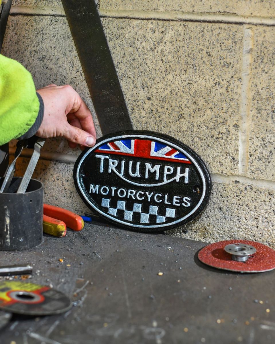Scale image of Black Triumph Vintage Style Cast Iron Sign Scale image of Black Triumph Vintage Style Cast Iron Sign
