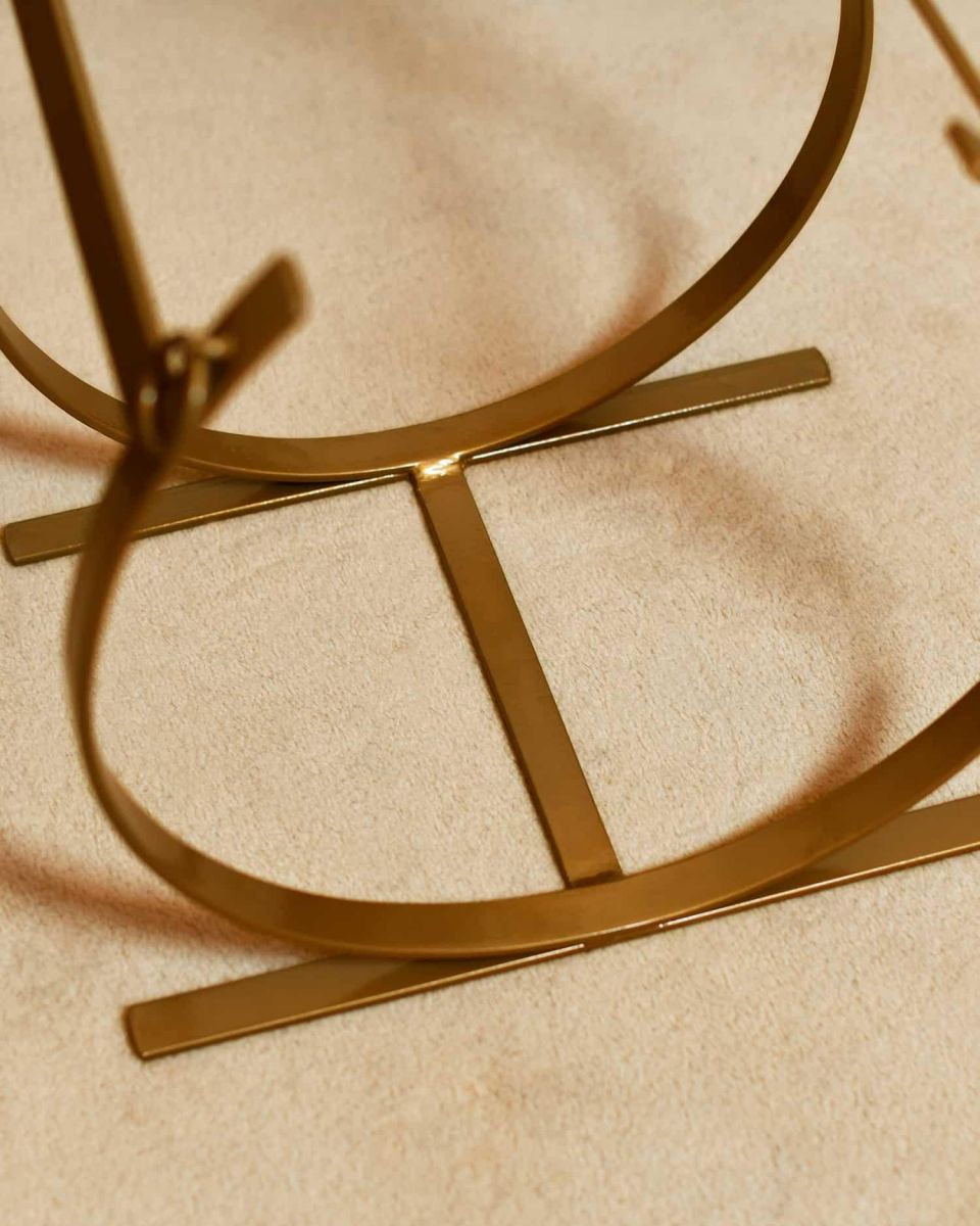 Close-Up of Emoty Blacksmith Brass Finish Curved Log Rack Close-Up of Emoty Blacksmith Brass Finish Curved Log Rack