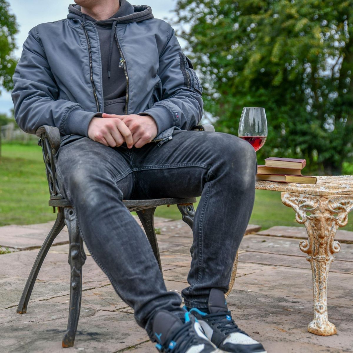 Male sat on Aged Black Heart Chair for scale Male sat on Aged Black Heart Chair for scale