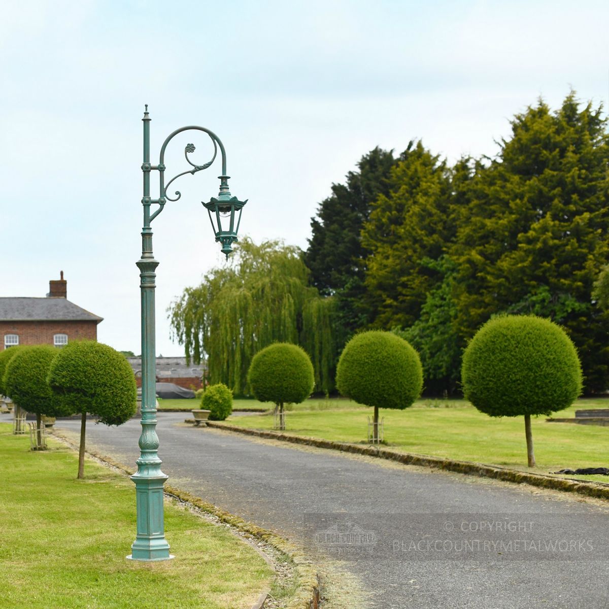 Blue Cast Iron Lamp Post In Period Garden Setting