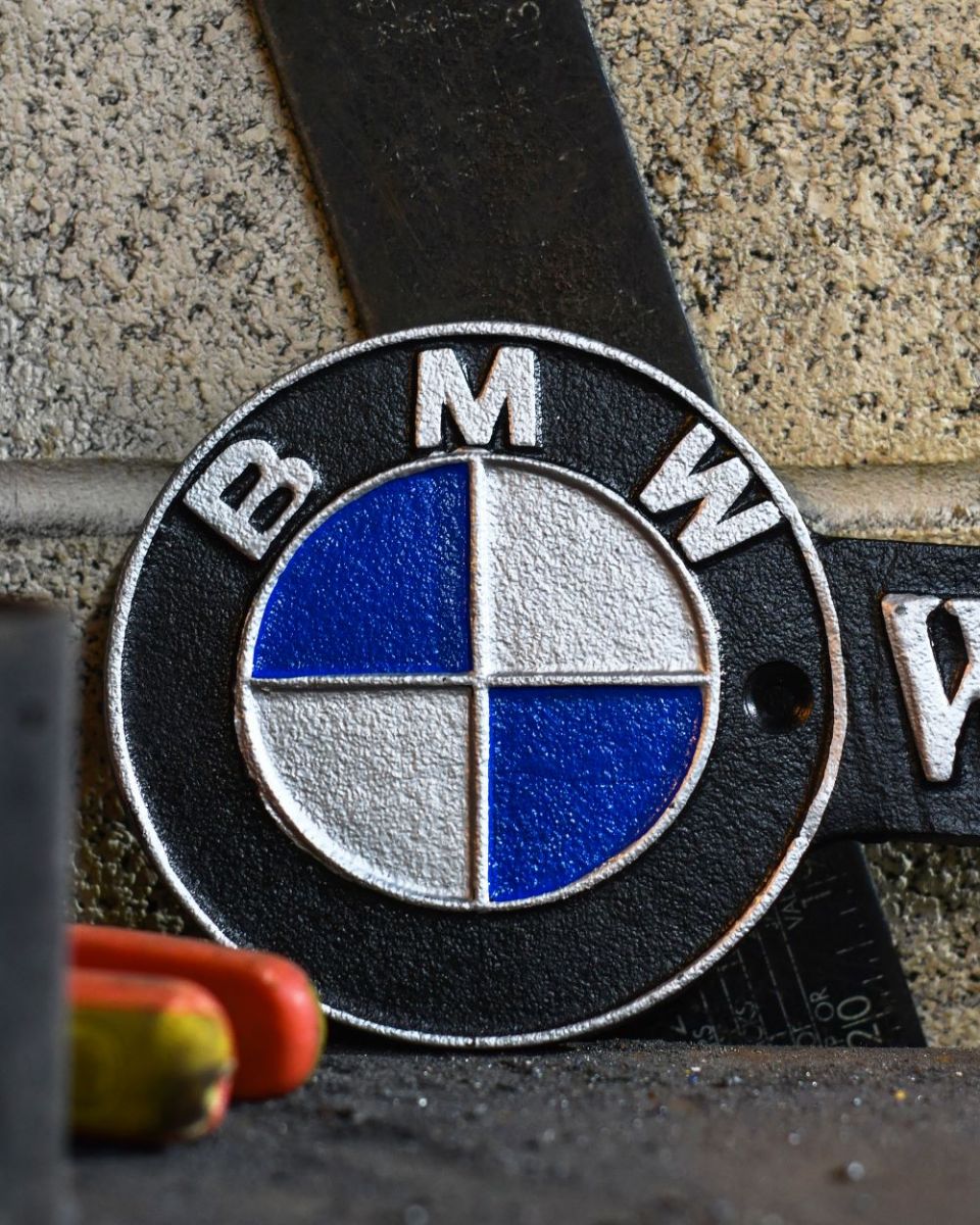 Close up of BMW Workshop Vintage Style Cast Iron Sign finish