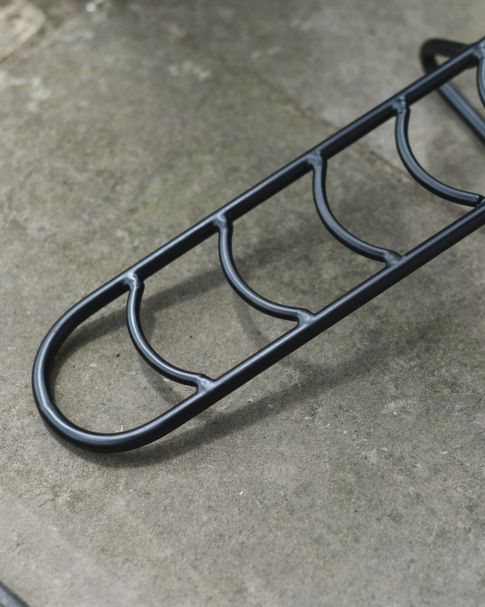 Close up of steel detailing on black boot jack