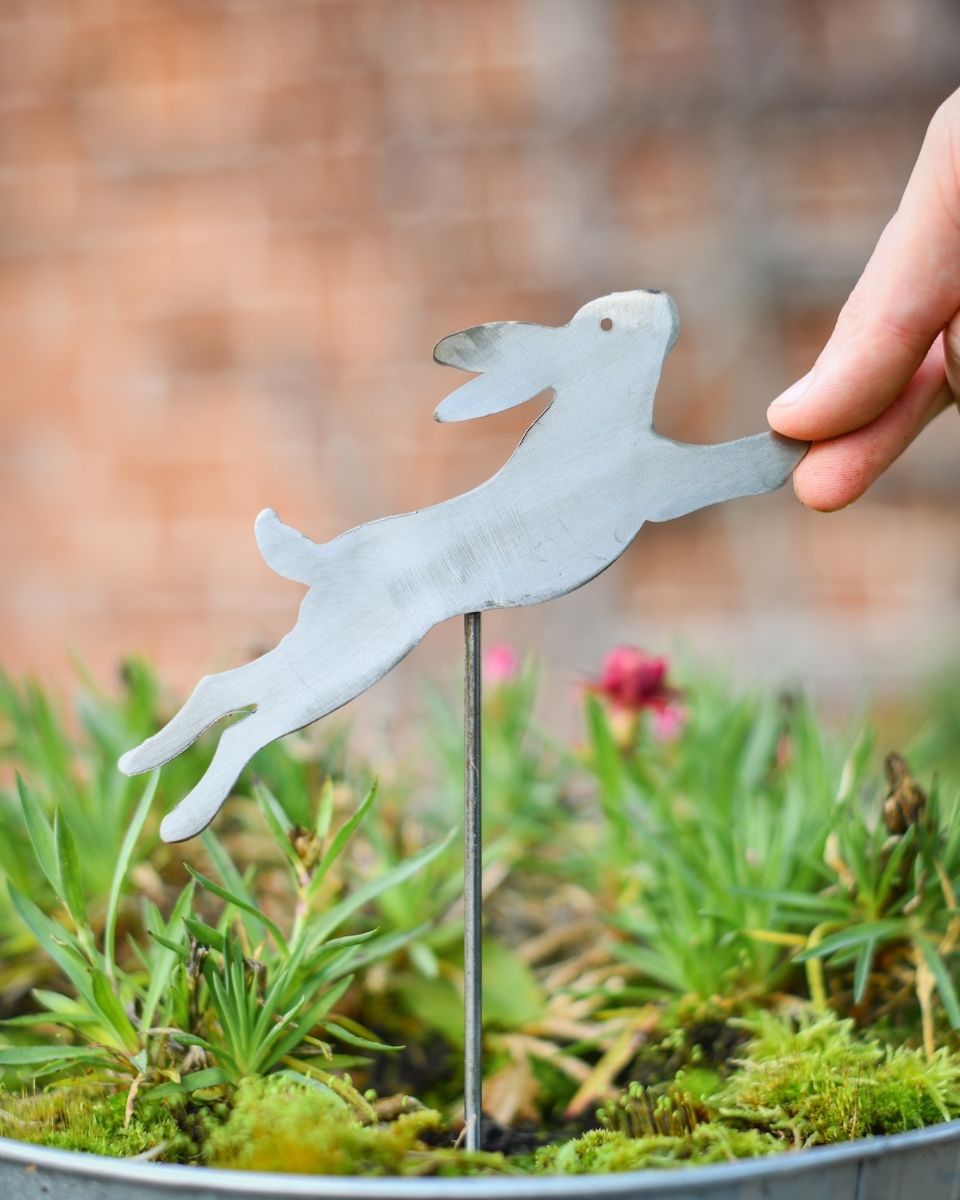 Bounding Hare Artistic Plant Pot Spike - Set of Two with hand in shot for scale