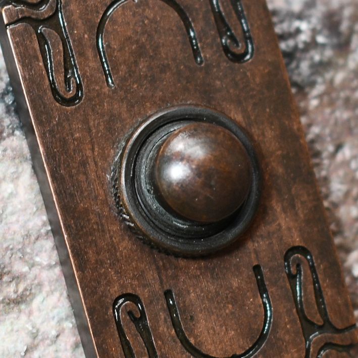 Close up image of Art Nouveau inspired Bell push plate