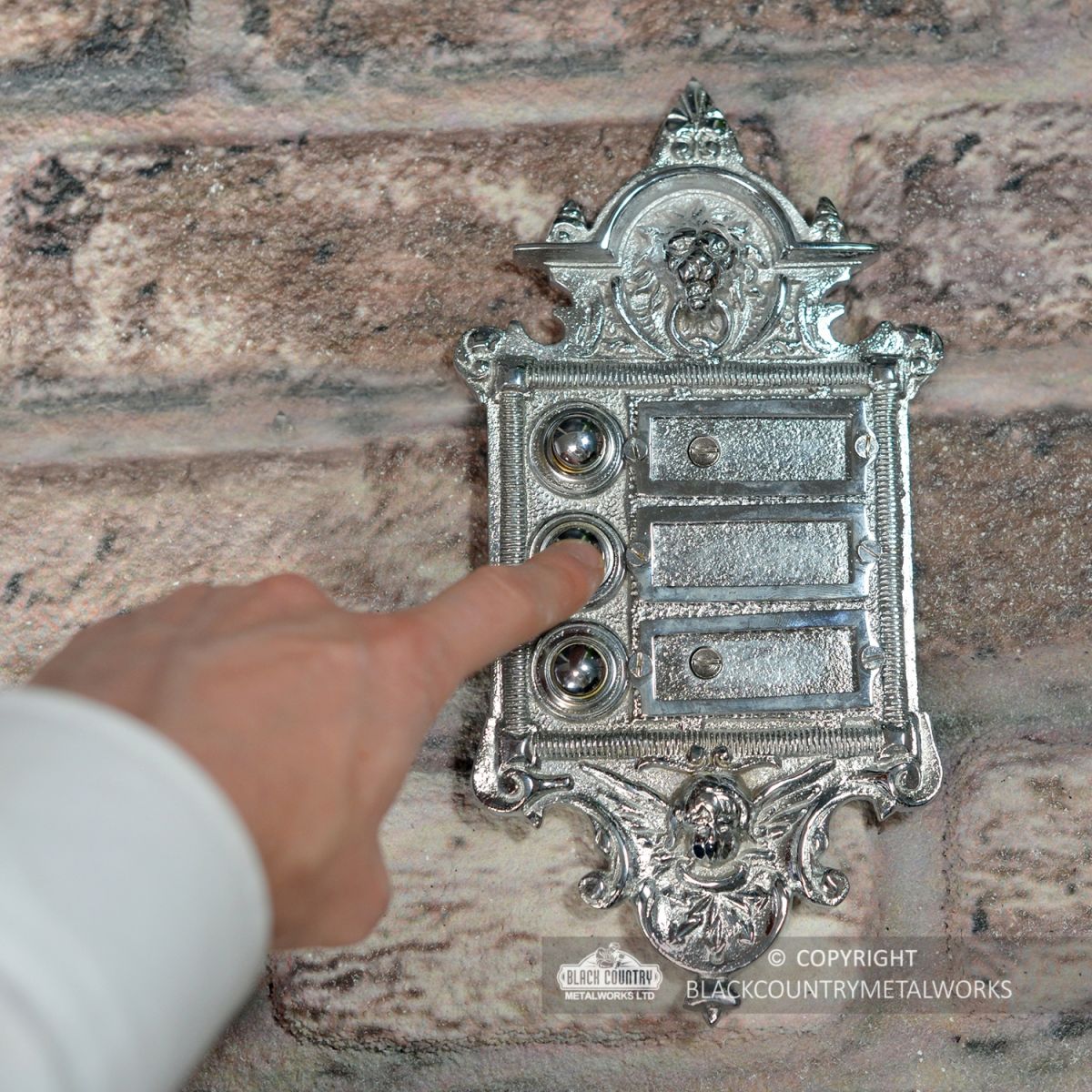 “Hazeldon Park" Bright Chrome Apartment Bell Push to Scale