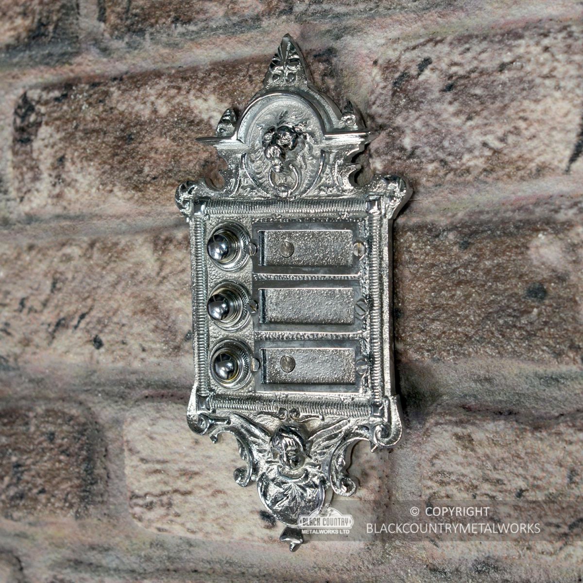  “Hazeldon Park" Bright Chrome Apartment Bell Push in Situ on a Wall