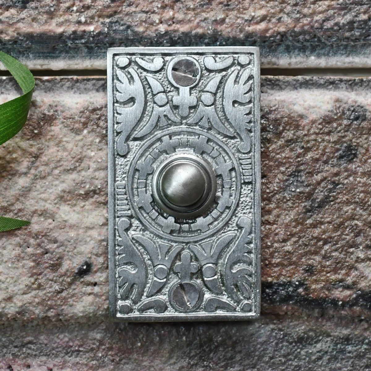 Satin Chrome Bell push on brick wall