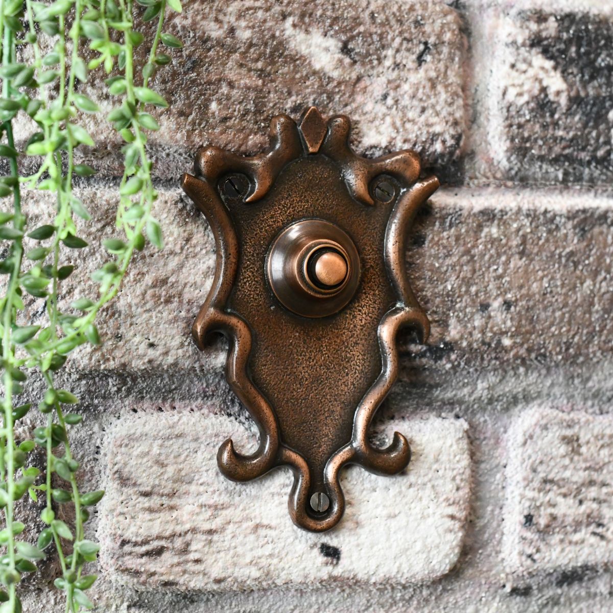 Antique door bell on brick wall