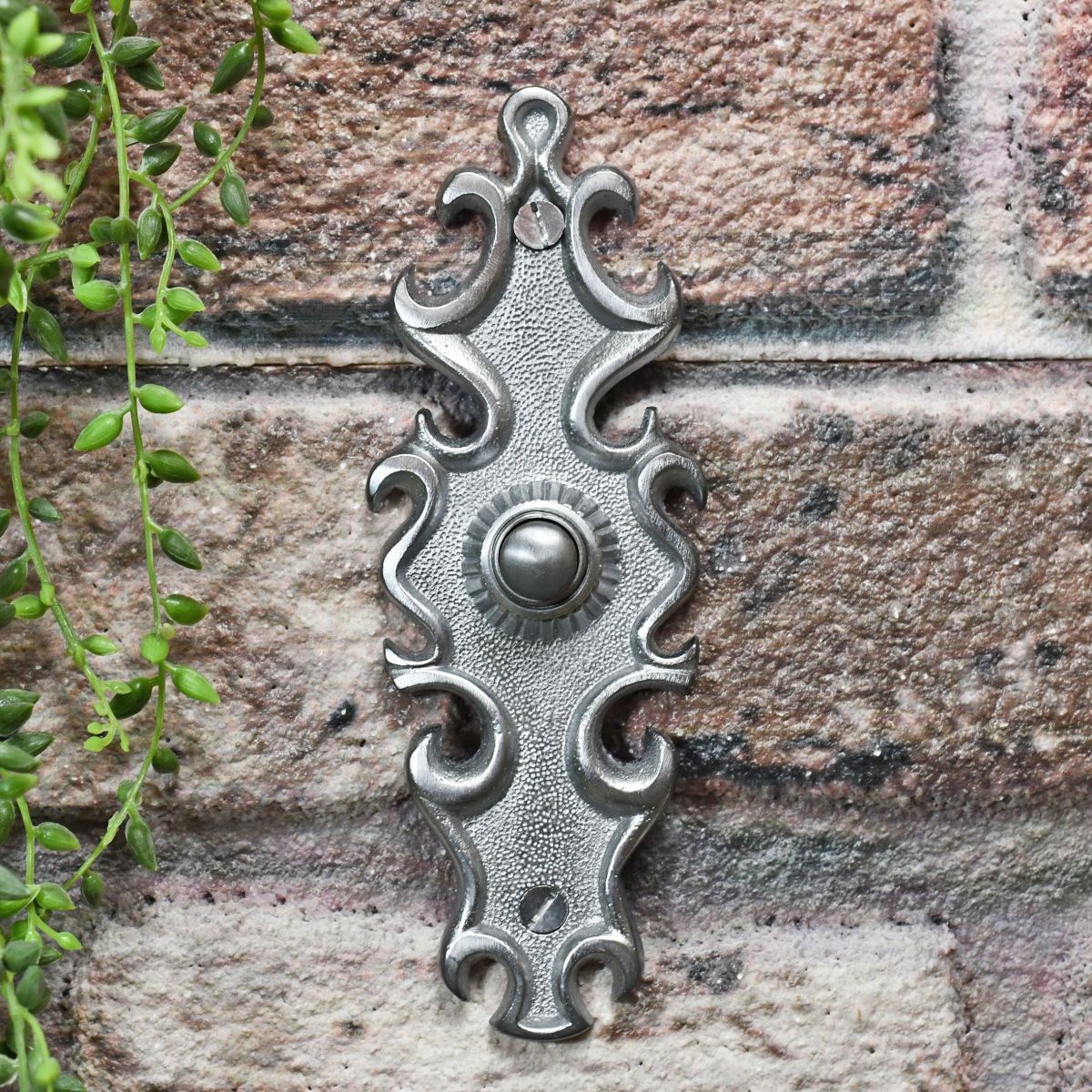 Satin Chrome Door Bell on brick wall Satin Chrome Door Bell on brick wall