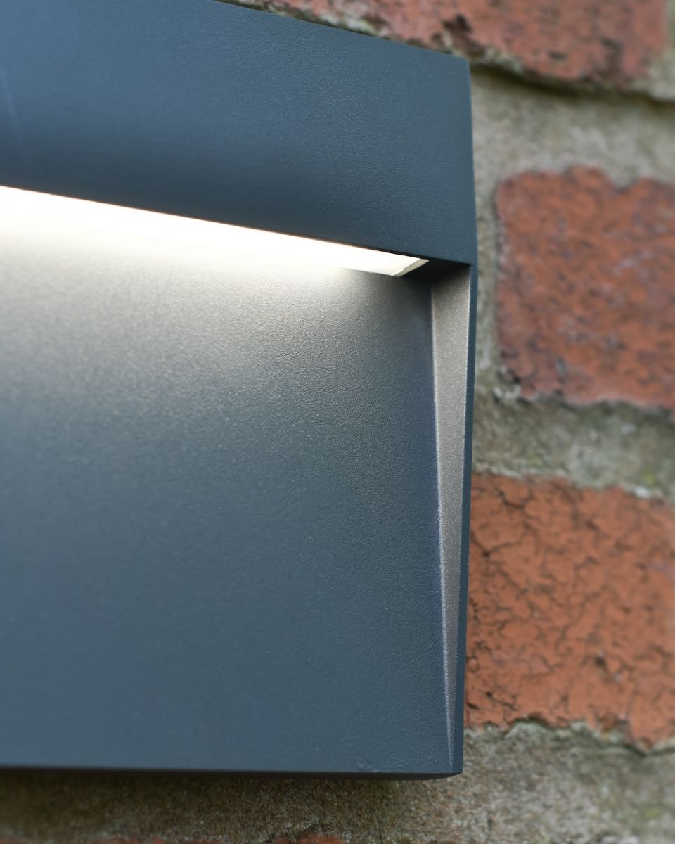 Close up of light detailing on garden wall light Close up of light detailing on garden wall light