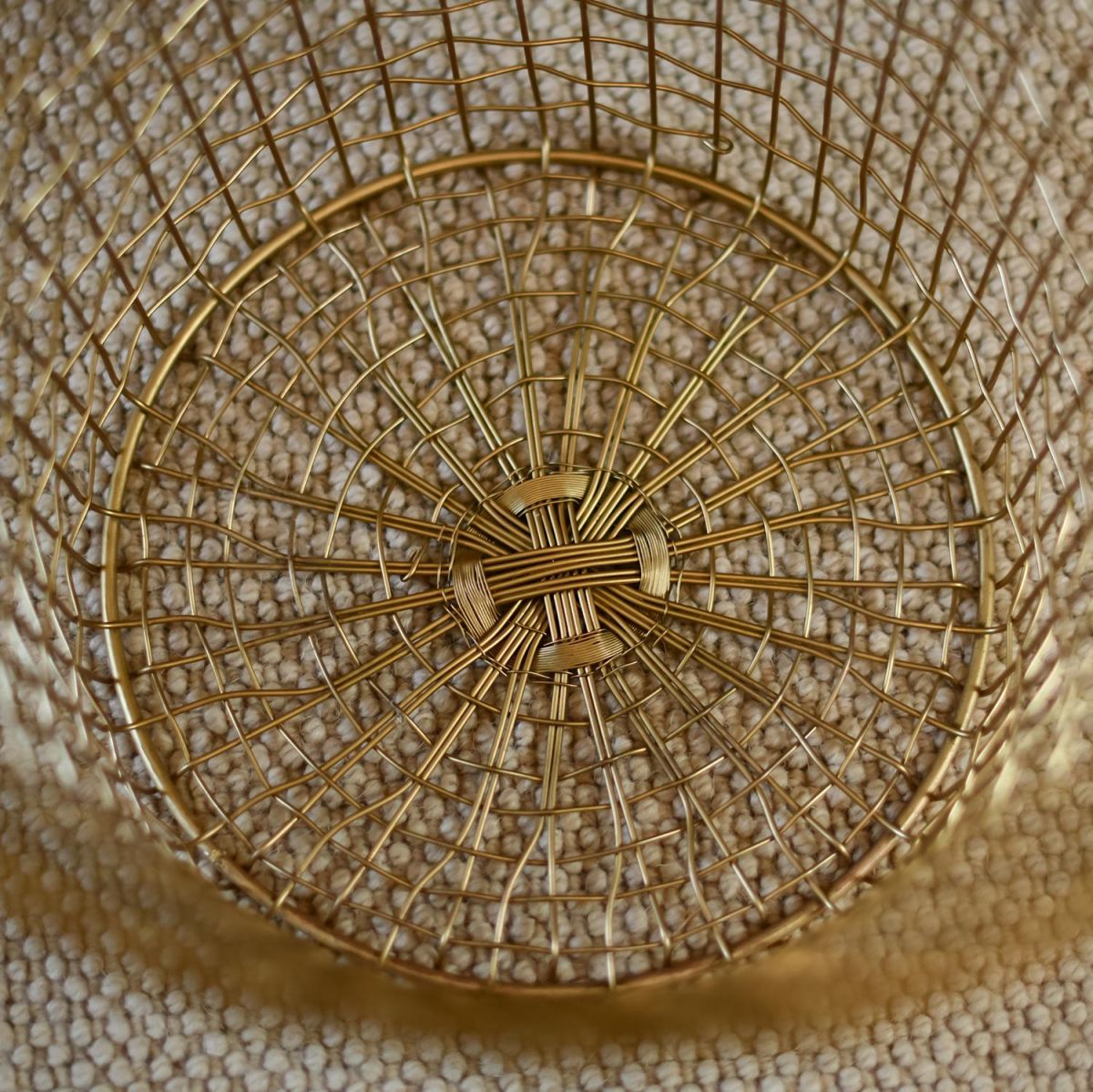 Close-up of the inside of the Brass Plated Wire Log Basket