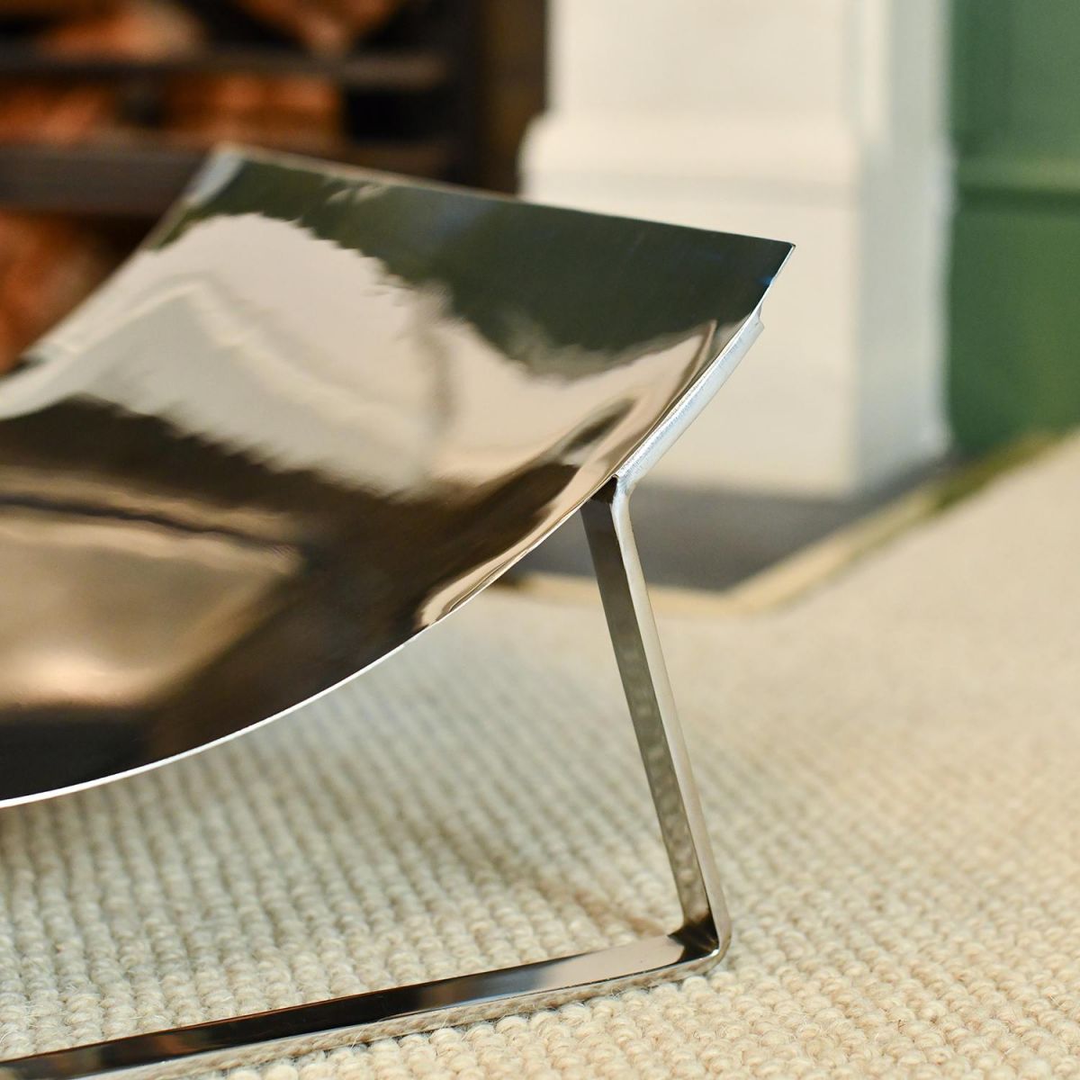 Close-up of the Bright Chrome Finish on the Curved Contemporary Log Holder Close-up of the Bright Chrome Finish on the Curved Contemporary Log Holder