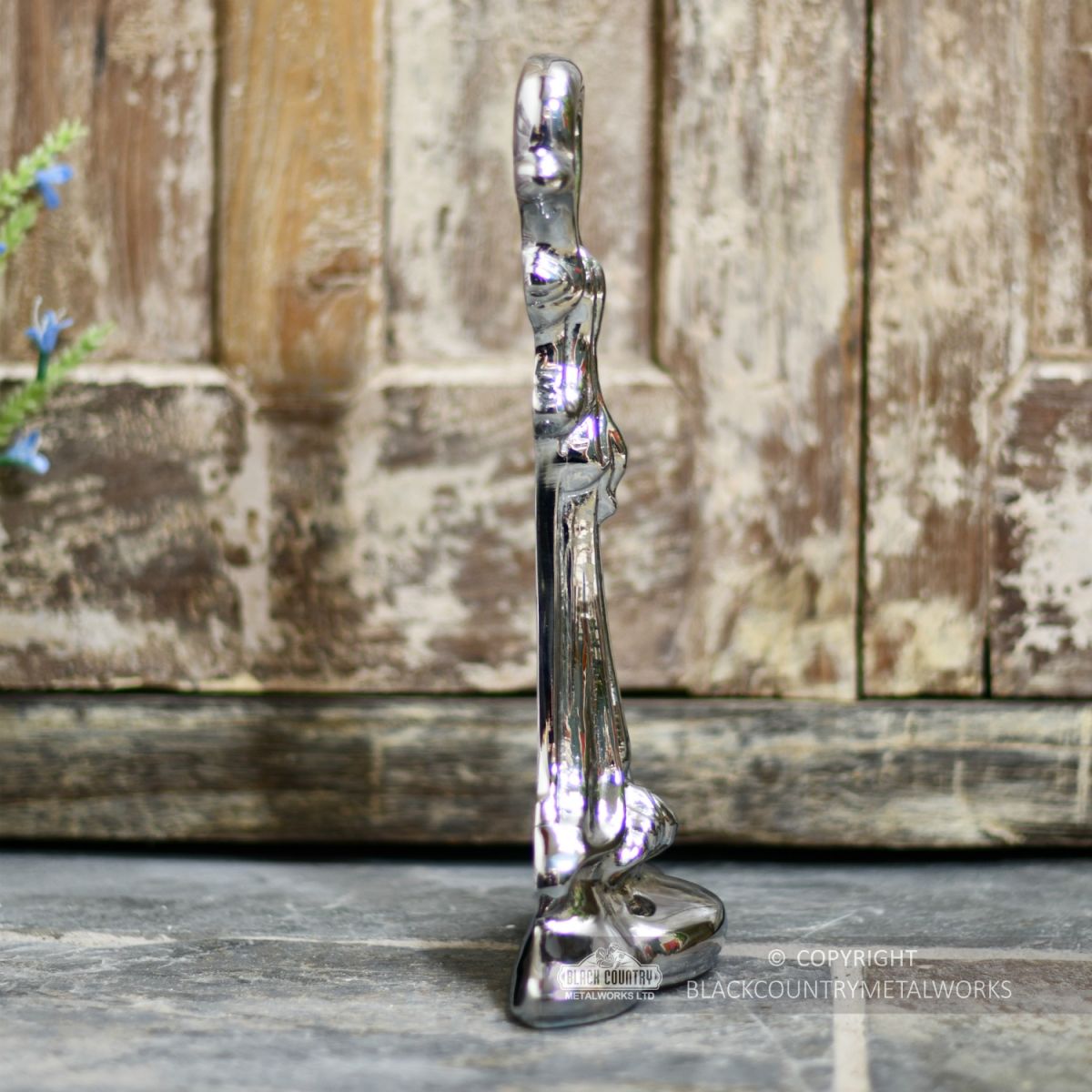 Bright chrome free standing door stop side view Bright chrome free standing door stop side view