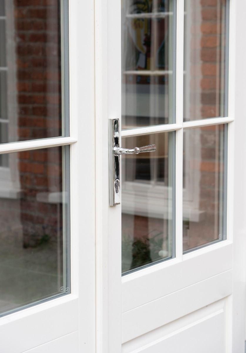 Bright Chrome Hammered Slimline Lever Door Handle on Door Bright Chrome Hammered Slimline Lever Door Handle on Door