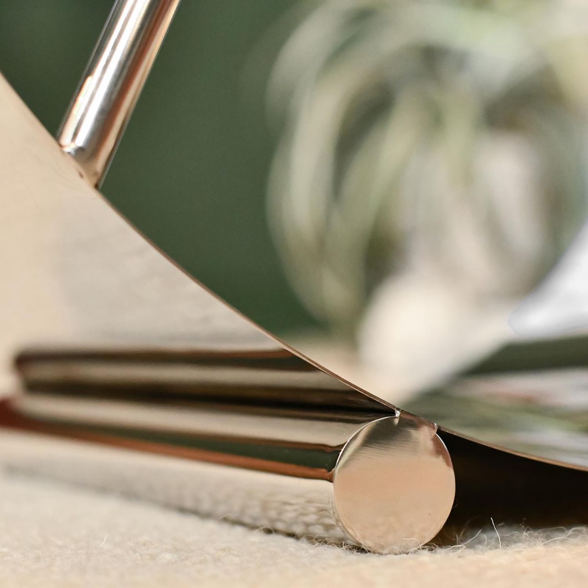 Close-up of the Base of the Bright Chrome Moon Log Holder