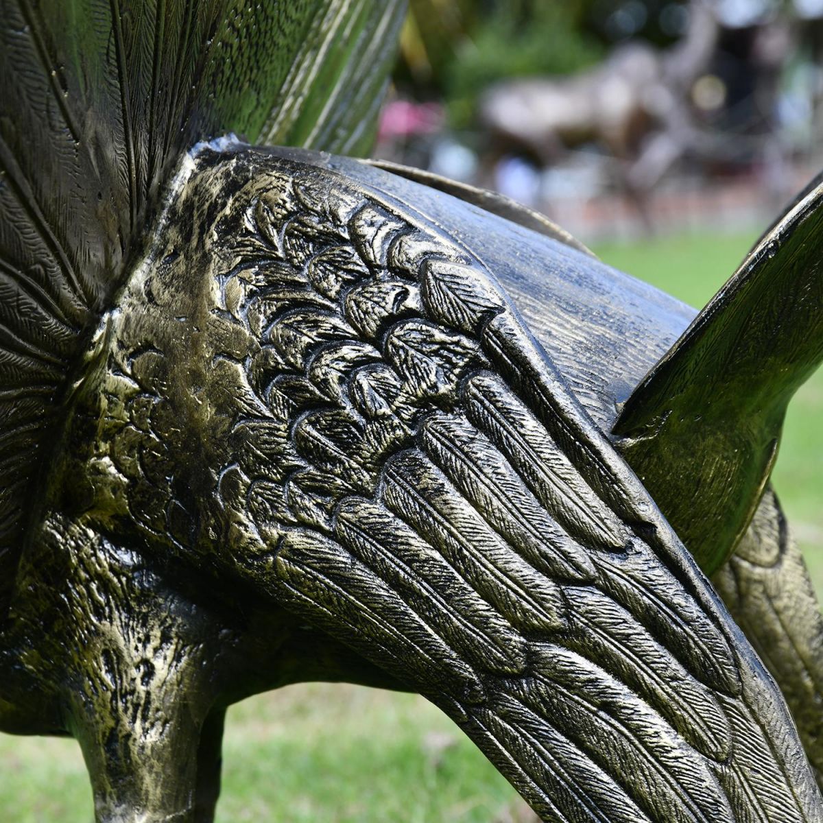 Close-up of the Detail on the Bronze Finish Peacock Sculpture with Open Tail 