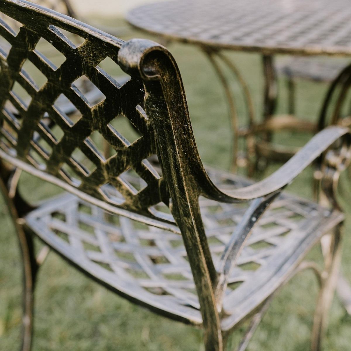 Close up of Lattice Chair on the Brushed Gold "Chigwell" Circular Four Seater Table & Chair Set Close up of Lattice Chair on the Brushed Gold "Chigwell" Circular Four Seater Table & Chair Set