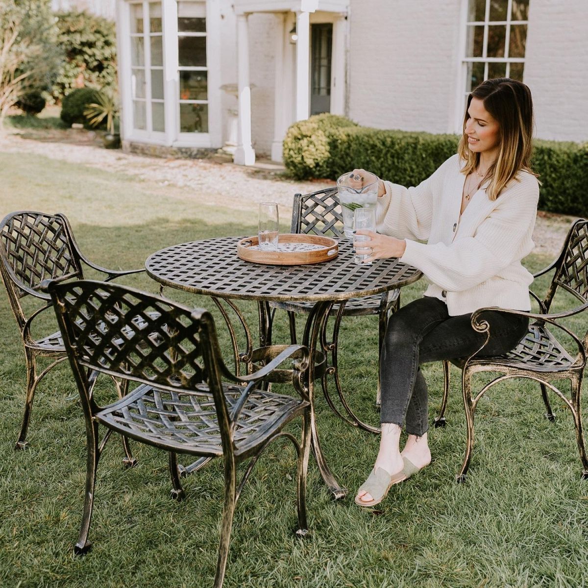 Brushed Gold "Chigwell" Circular Four Seater Table & Chair Set in Garden Setting  Brushed Gold "Chigwell" Circular Four Seater Table & Chair Set in Garden Setting