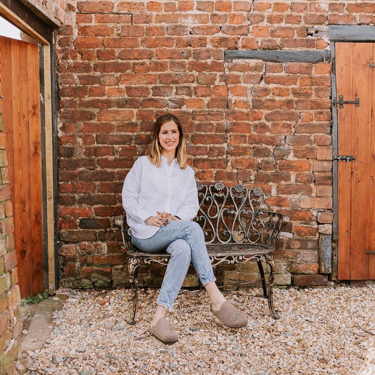Brushed Gold "Chorley" Daisy Bench with Woman for Scale  Brushed Gold "Chorley" Daisy Bench with Woman for Scale