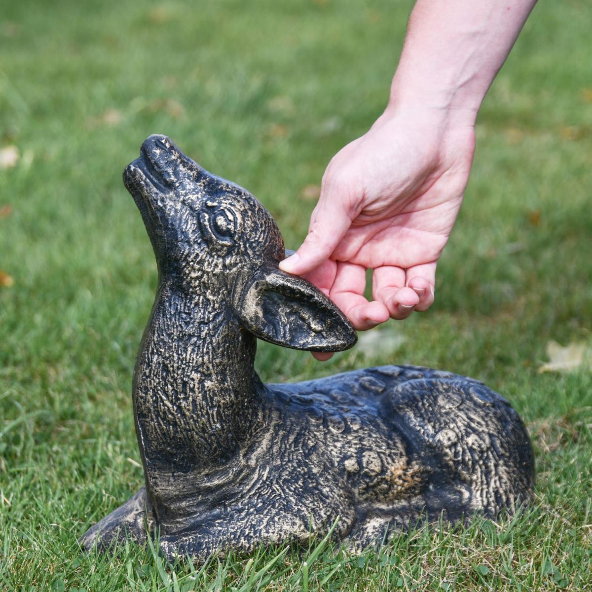 Scale Shot of Brushed Gold Recycled Cast Aluminium Baby Deer Sculpture - Lying Down