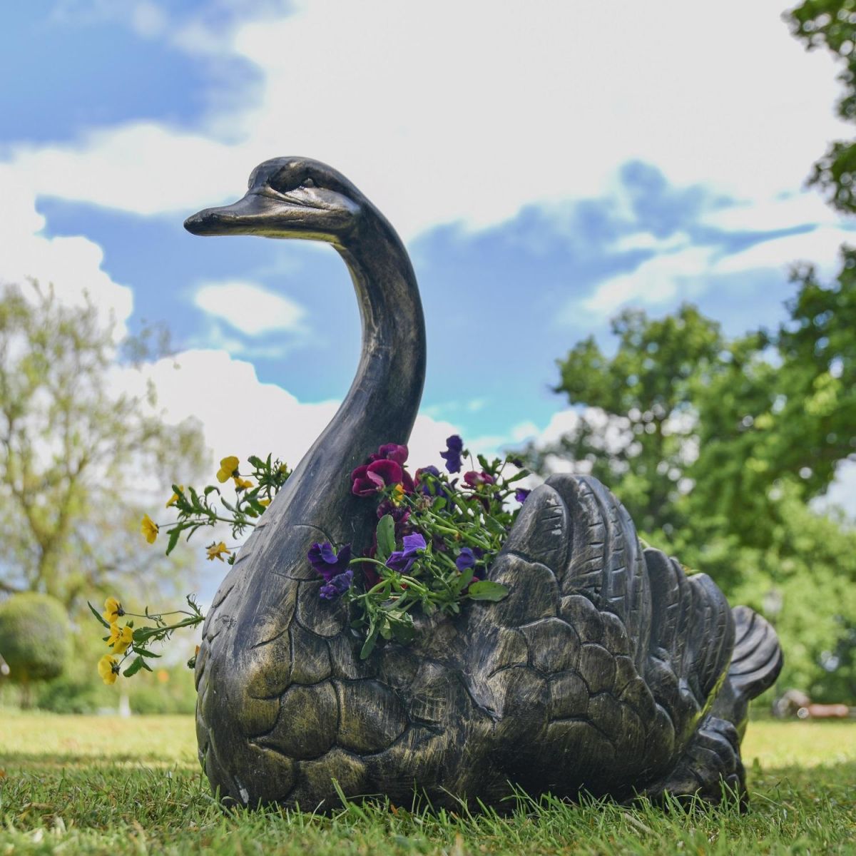 Brushed Gold Swan Flower Planter in Garden Brushed Gold Swan Flower Planter in Garden