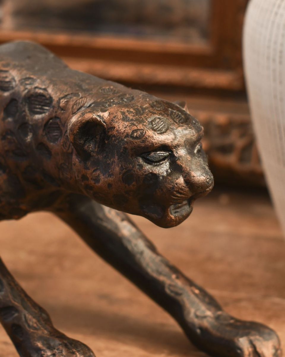 Close up of bronze leopard head