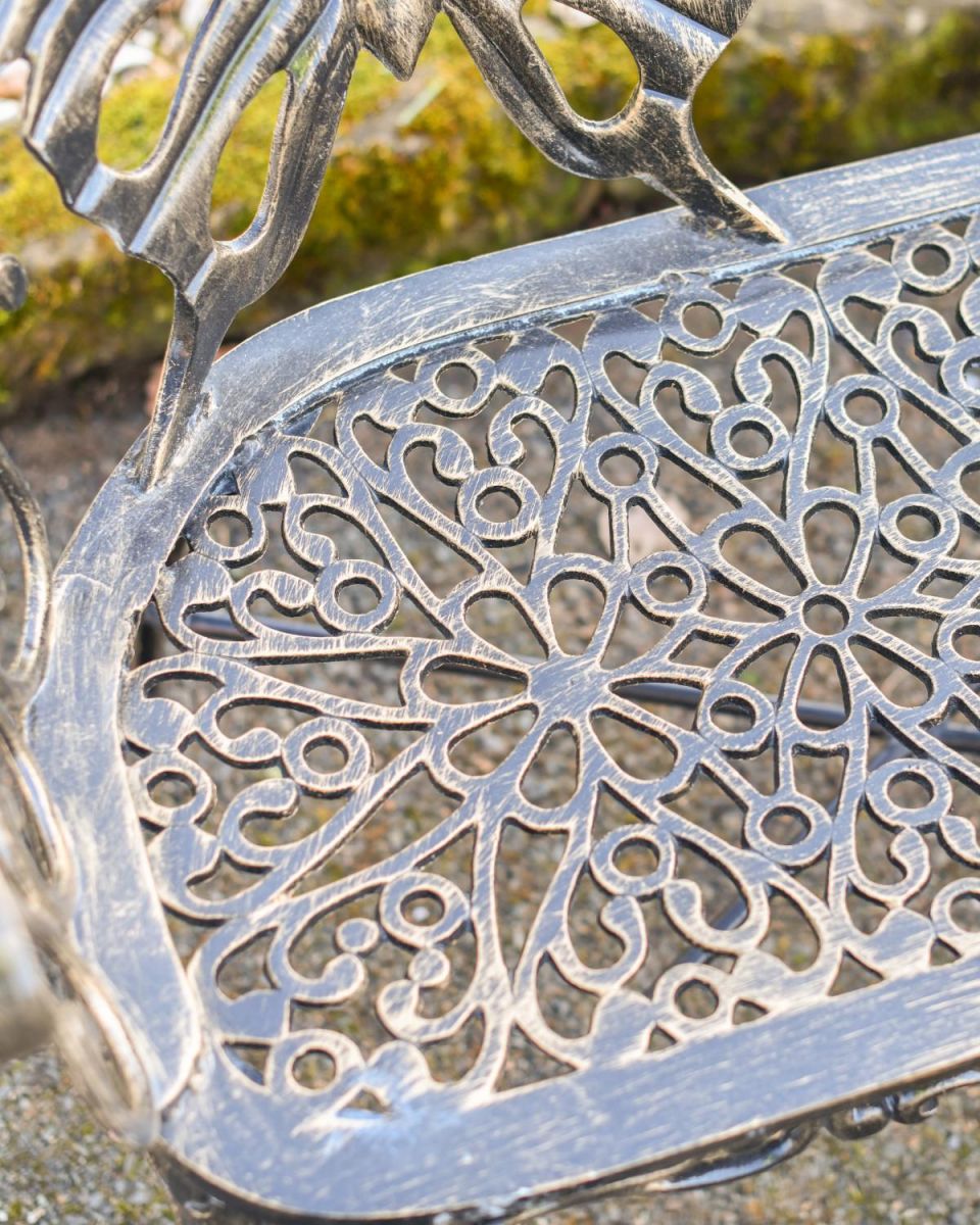 Close Up Of Butterfly Design Two Seater Bench Seat Detailing