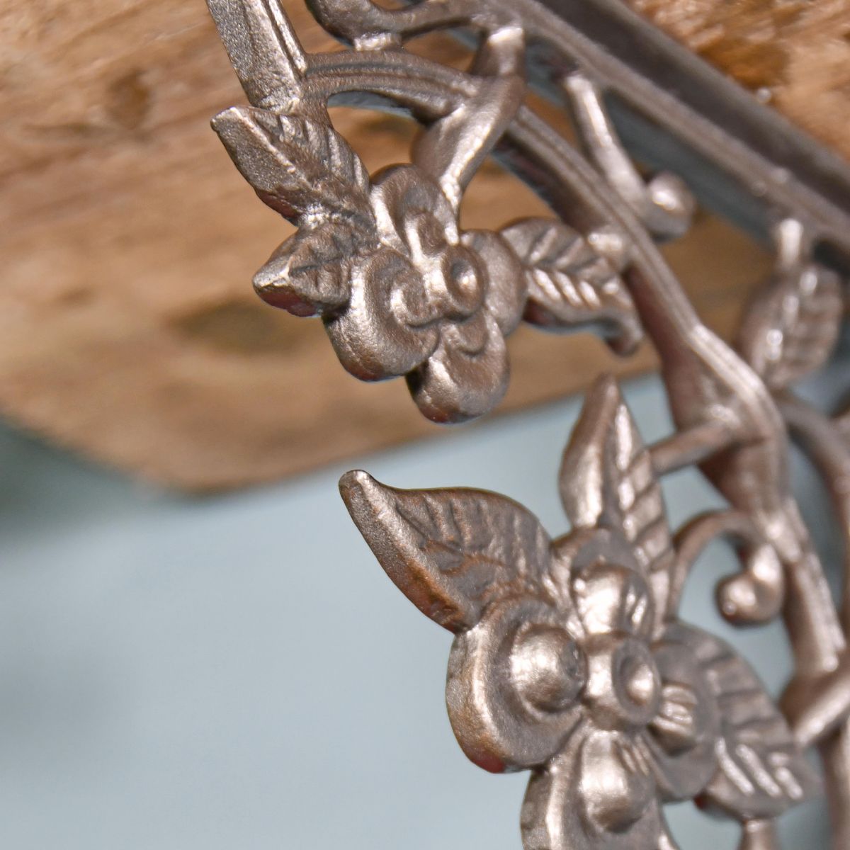 Close up of flowers and vine iron bracket  Close up of flowers and vine iron bracket