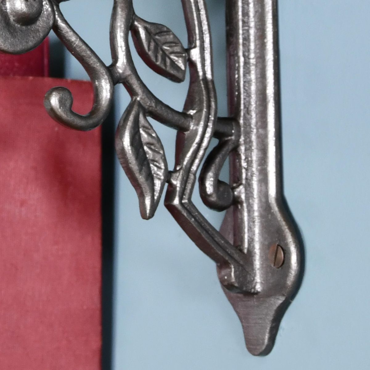 Close up of iron shelf bracket and mounting arm Close up of iron shelf bracket and mounting arm