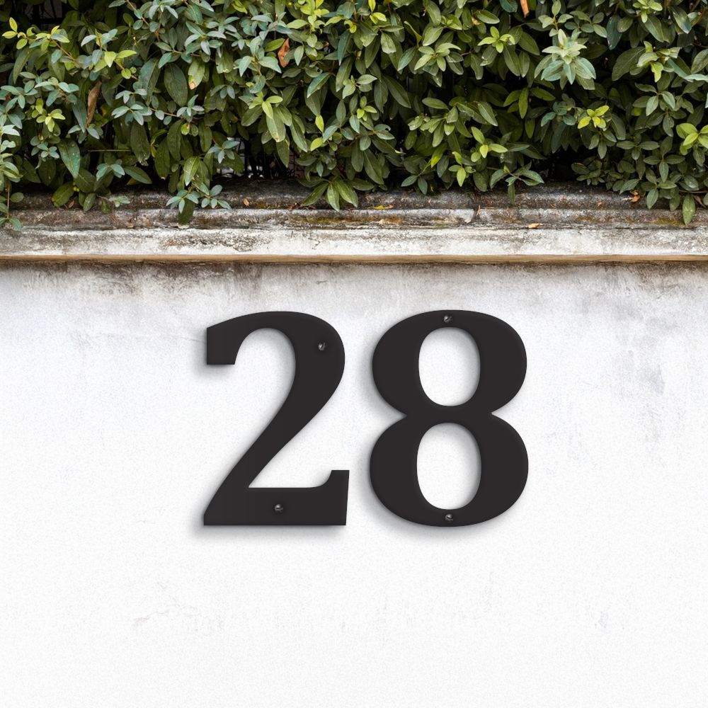 Black Individual House Numbers - Cambria Font on garden wall