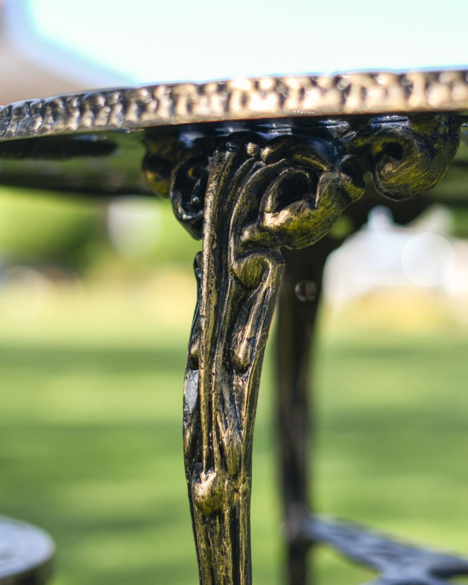 Close-Up of Antique Gold Finish on Cast Aluminium "Athena" Two Seater Outdoor Bistro Set Close-Up of Antique Gold Finish on Cast Aluminium "Athena" Two Seater Outdoor Bistro Set