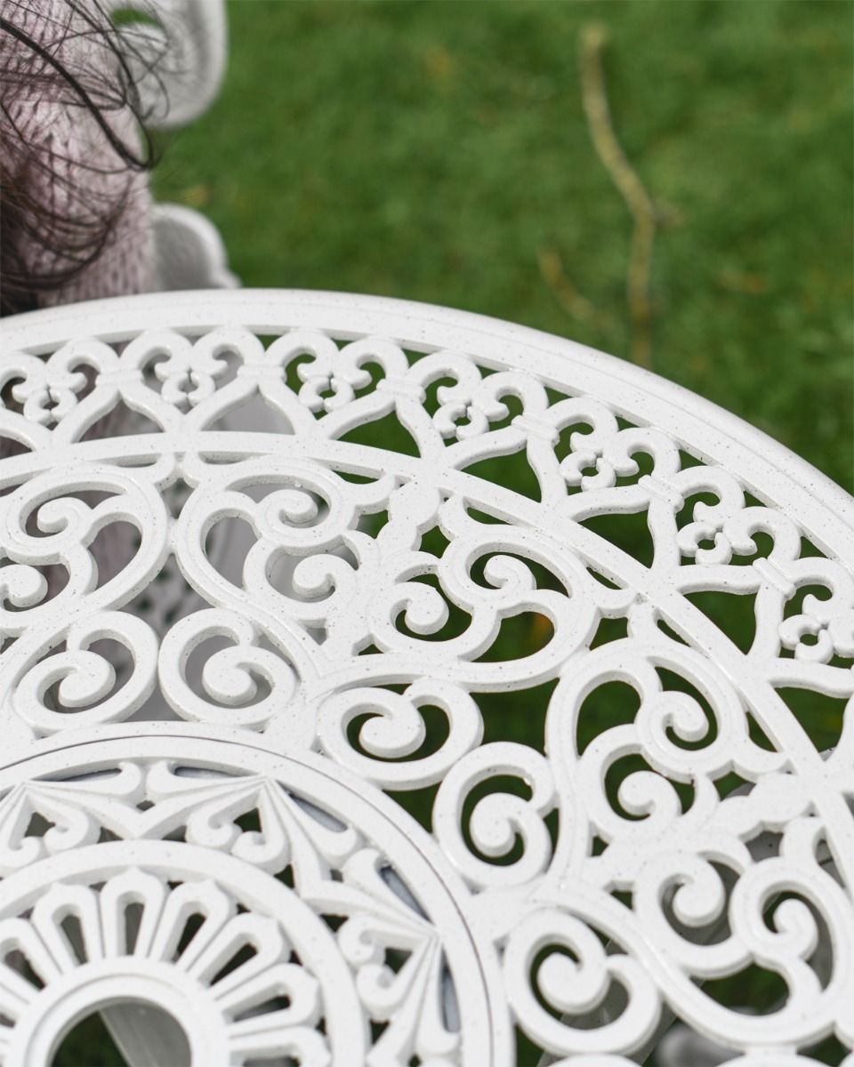 Close up of Swirl Metalwork Pattern on Garden Table 