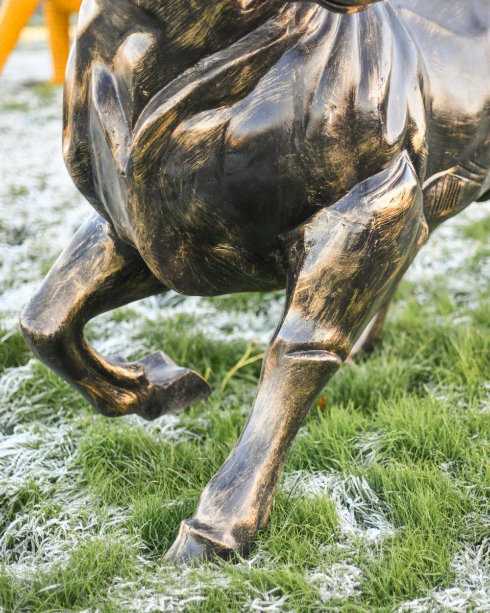 Close-Up of Brushed Gold Finish on Raging Bull Sculpture