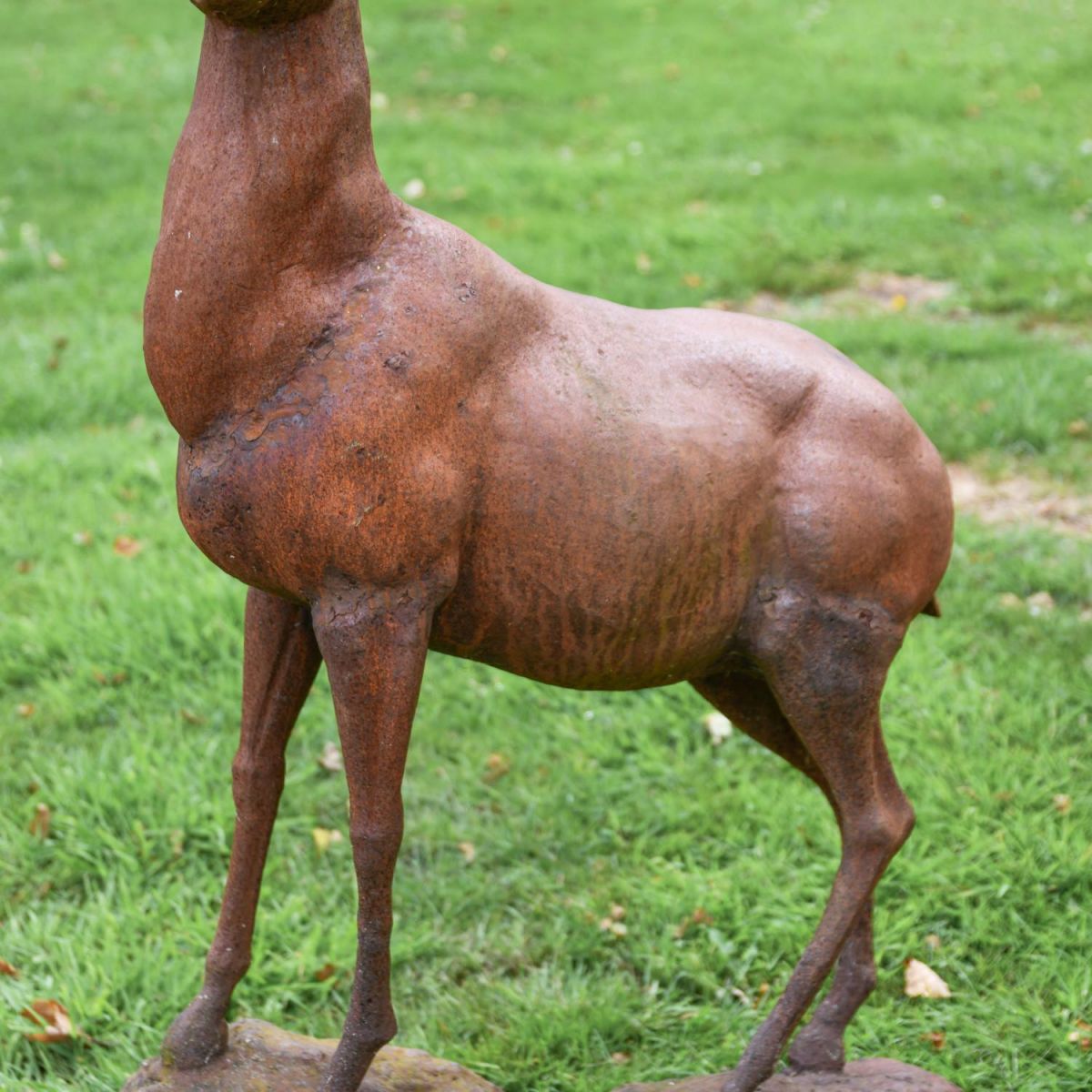 Close-Up of Body on Cast Iron Stag Standing on Rock Sculpture