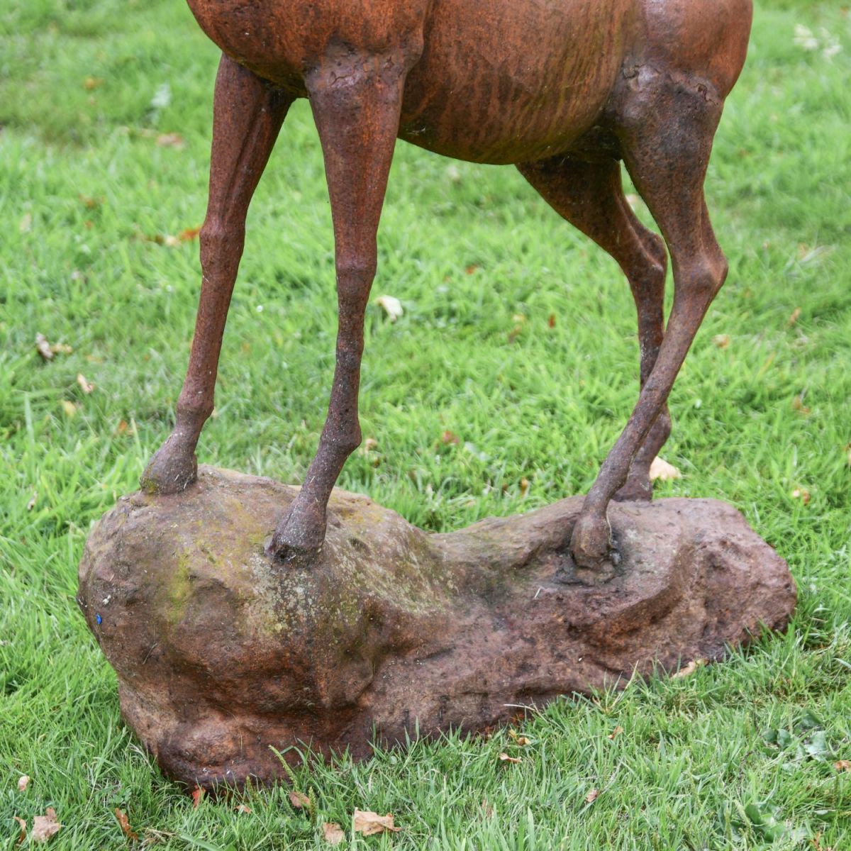 Close-Up of Base on Cast Iron Stag Standing on Rock Sculpture
