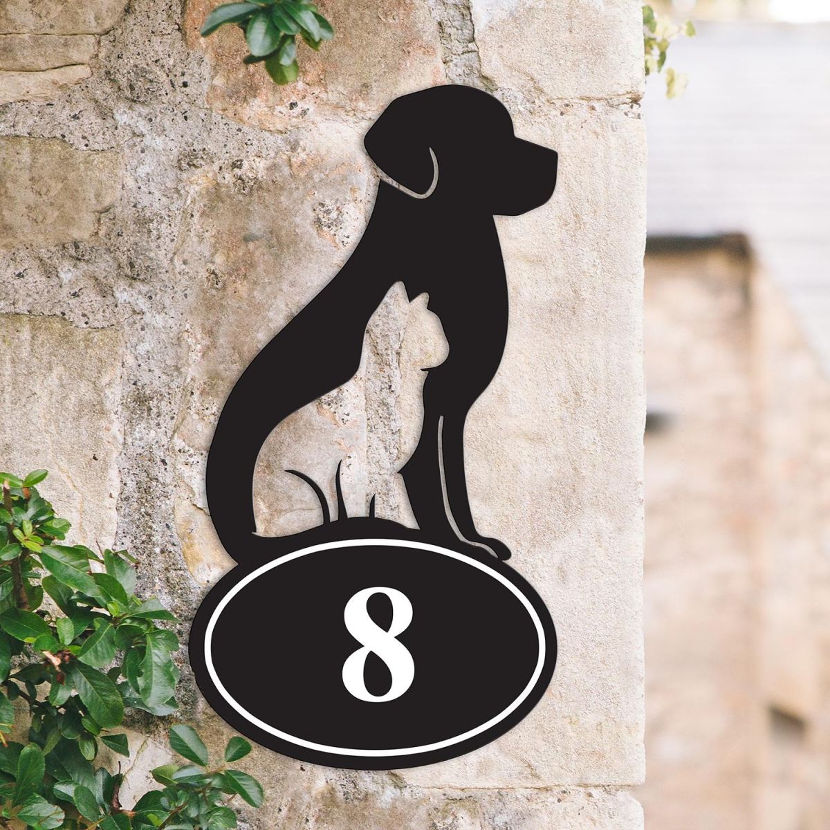 Cat & Dog Iron House Number Sign on a Garden Wall