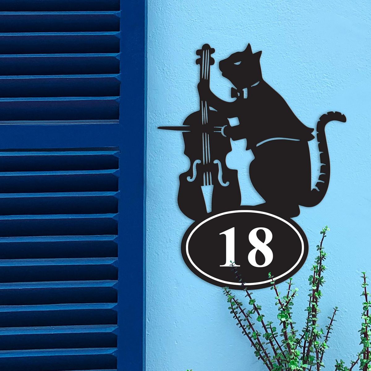 Iron Cat & Fiddle House Number Sign in Situ on a Blue Wall 