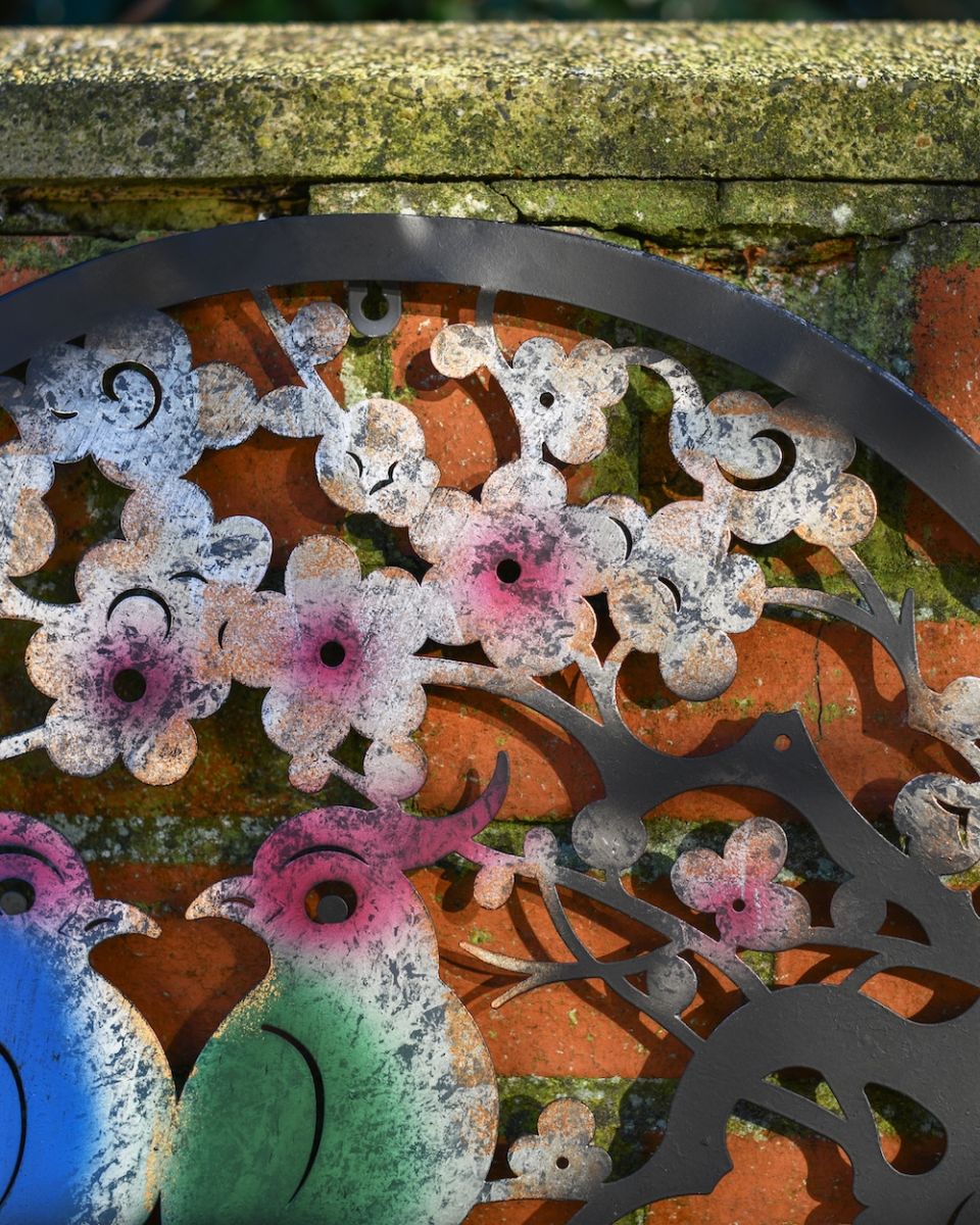 Close up of cherry blossom detail on steel garden wall art 