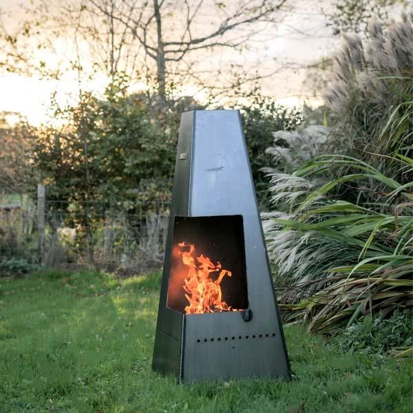 Chimenea With Swing Arm Grill in Use in the Garden Chimenea With Swing Arm Grill in Use in the Garden