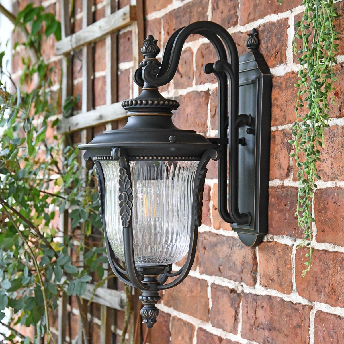 Side View of the "Christleton" Bronze Wall Mounted Porch Light Mounted on a Brick Wall