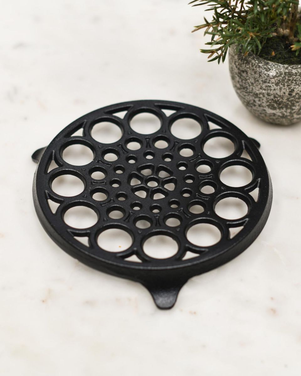 Situ Shot of Circular "Spotted" Cast Iron Trivet in Black Situ Shot of Circular "Spotted" Cast Iron Trivet in Black