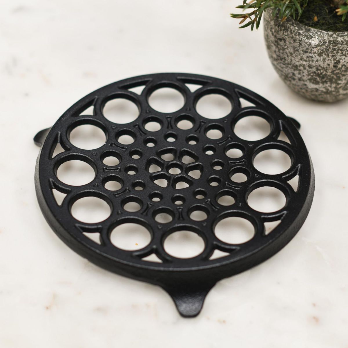 Circular "Spotted" Cast Iron Trivet in Black Circular "Spotted" Cast Iron Trivet in Black
