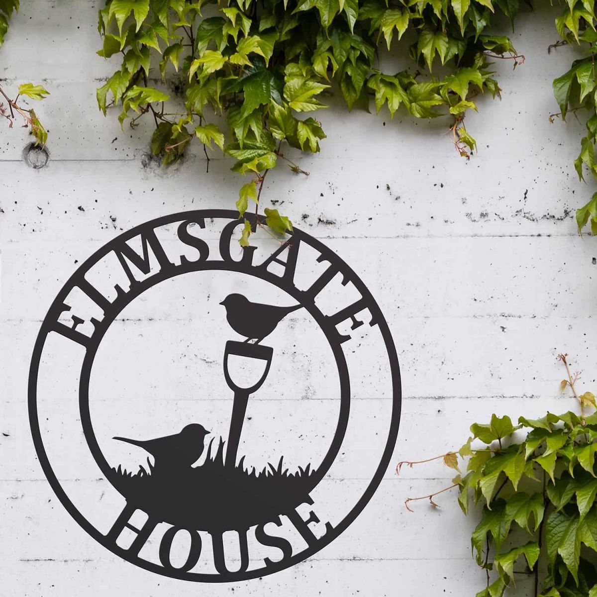 Situ Shot of Circular Steel House Name Sign with "Gardening Robins" Design