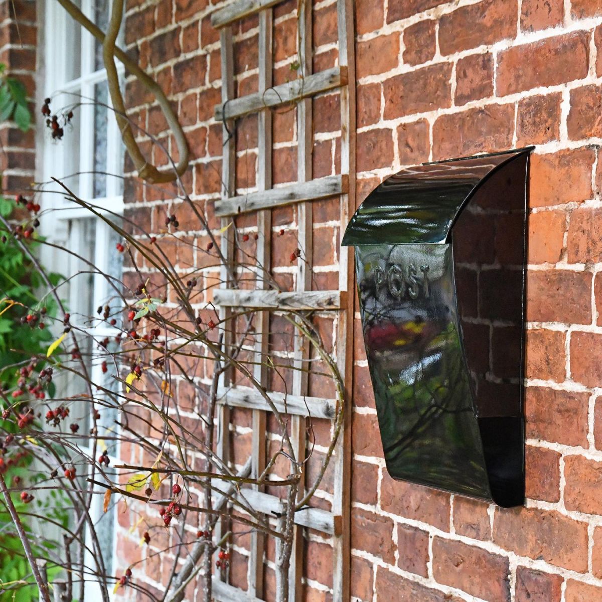 "Cityscape" Black Contemporary Post Box With Lock and Newspaper Holder in Situ on the Front of a House