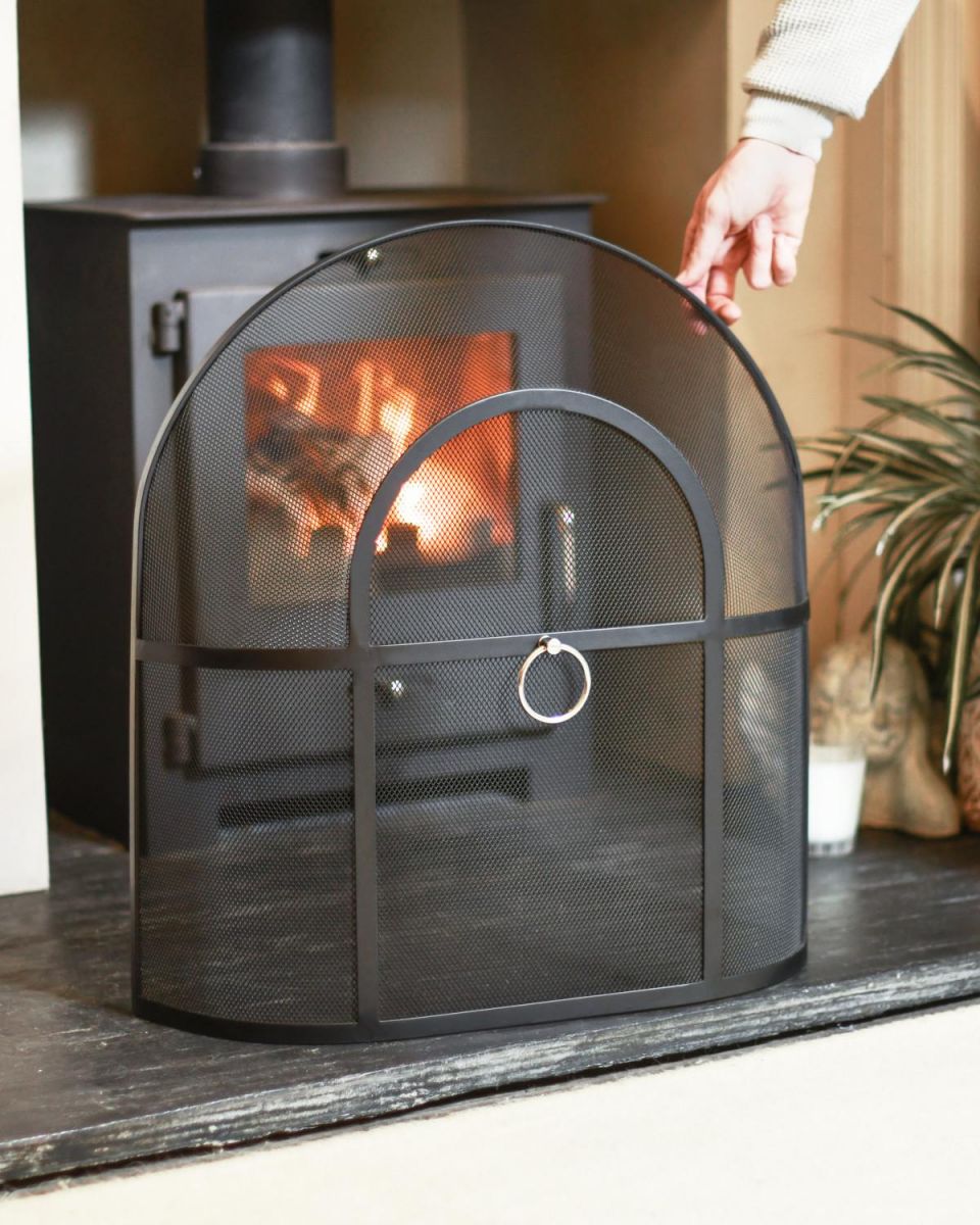 Scale Shot Of Classic Black Arched Fire Guard with Circular Handle