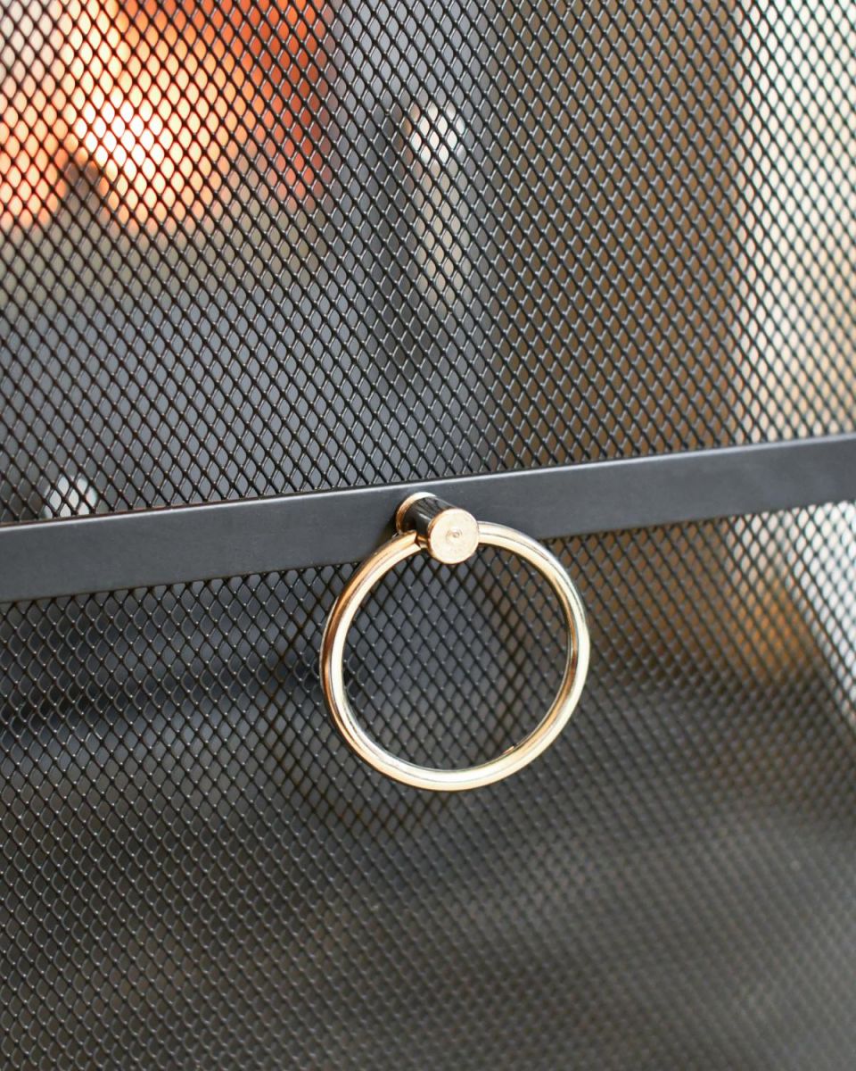Close Up Of Classic Black Arched Fire Guard with Circular Handle Handle