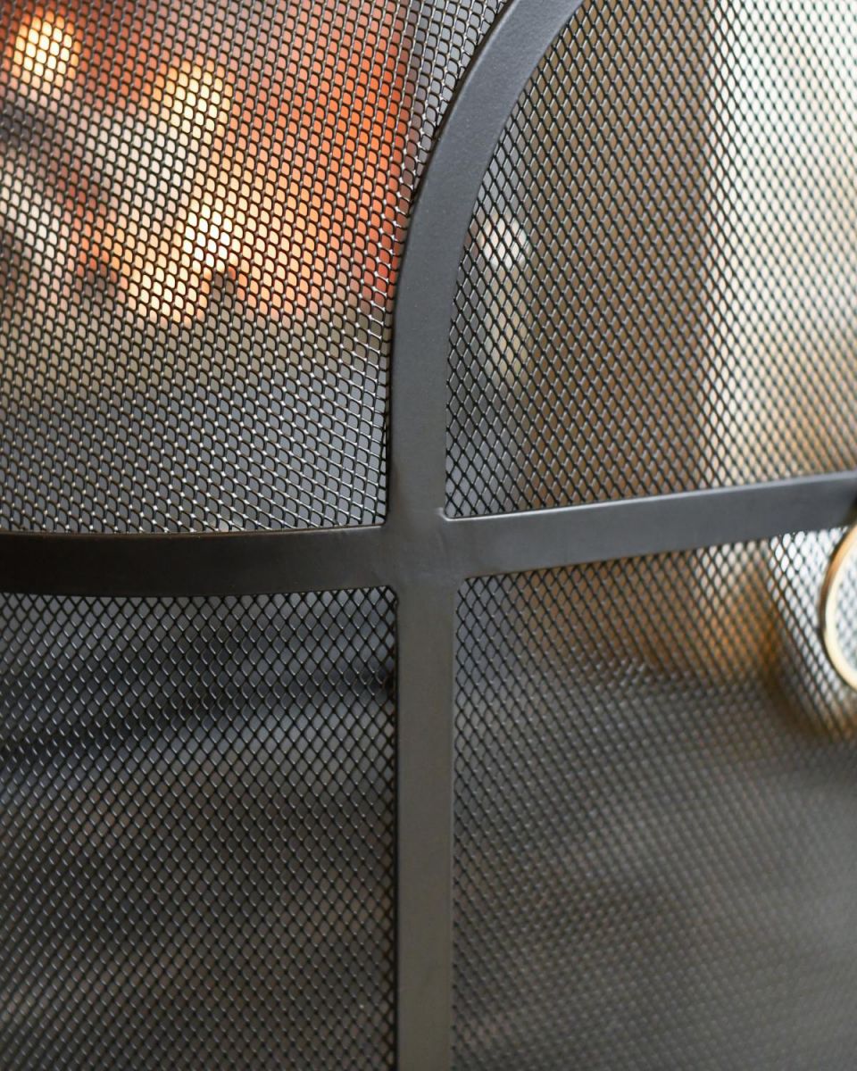 Close Up Of Classic Black Arched Fire Guard with Circular Handle Mesh